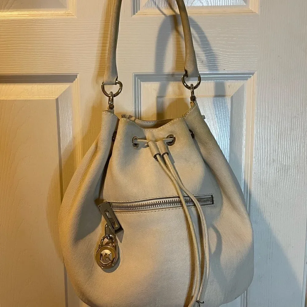 Michael Michael Kors leather beige drawstring bucket satchel.silver tone accents